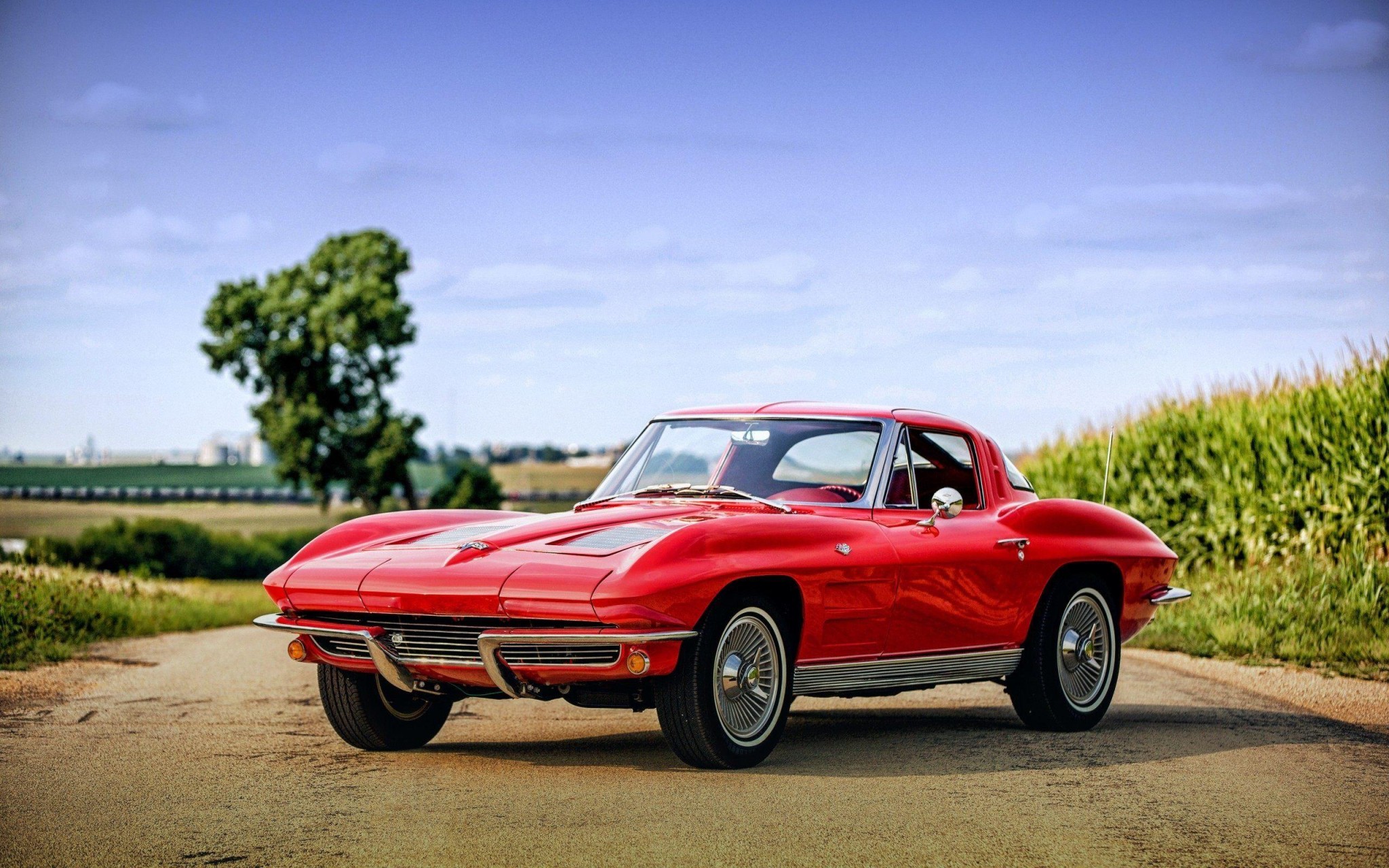 Classic Red Corvette Country Road Wallpaper