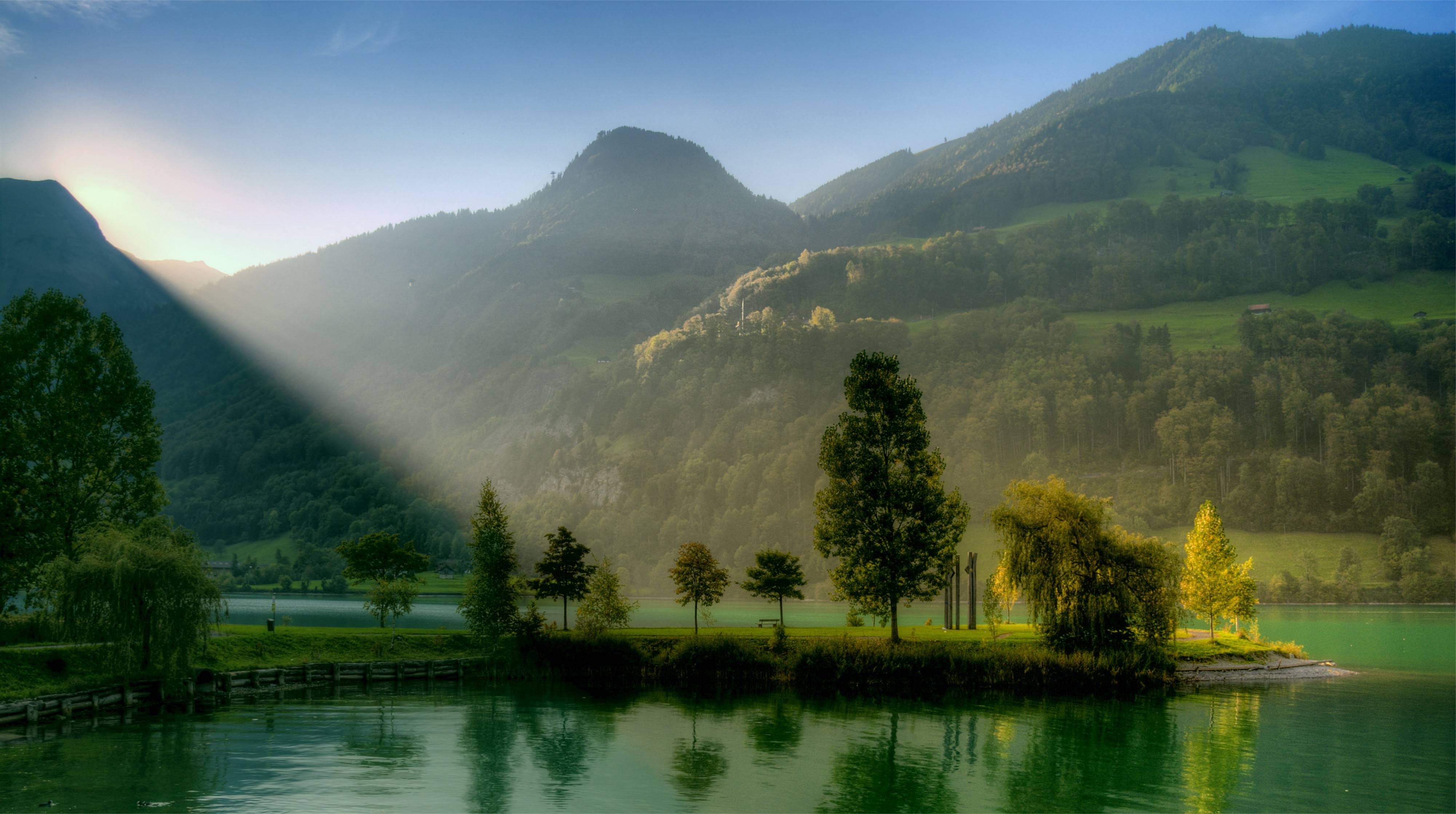 Sunlit Mountain Lake Reflection Wallpaper – free HD wallpaper
