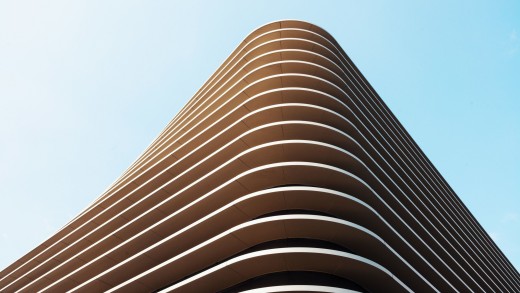 curved-modern-architecture-wallpaper-tan-building-2560×1440